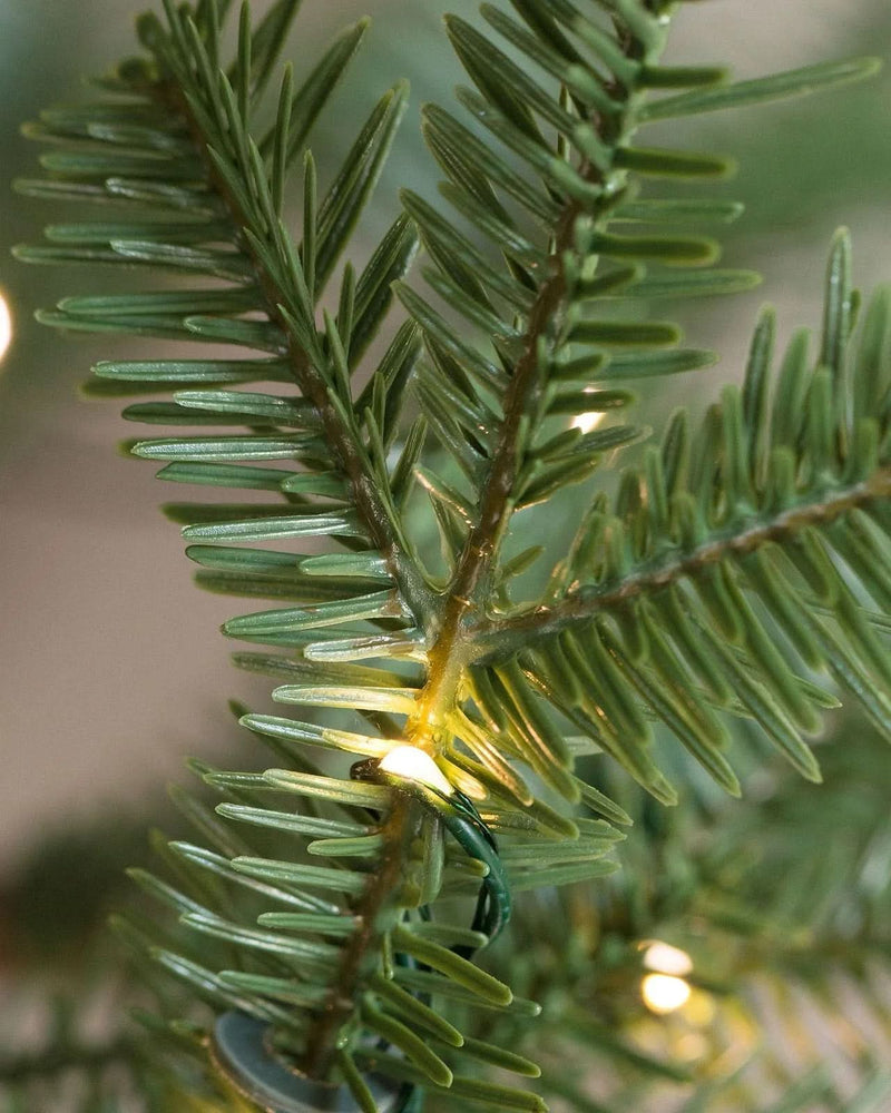 Slim Alpine Christmas Tree with Hinged Branches, Metal Stand, and Built-in Micro LEDs