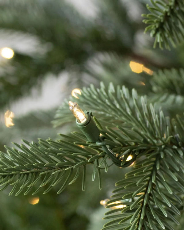 European Fir Christmas Tree with Hinged Branches, Metal Stand, and Built-in Micro LEDs