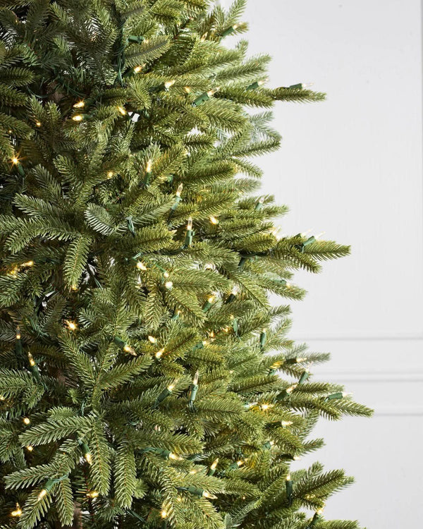 Silverado Slim Christmas Tree with Hinged Branches, Metal Stand, and Built-in Micro LEDs